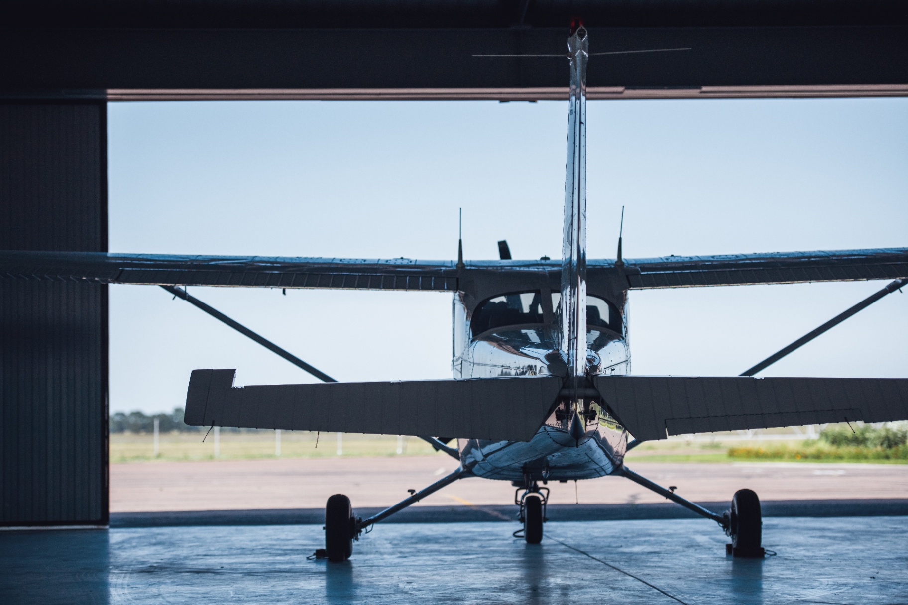 Aircraft framed in hangar doorway